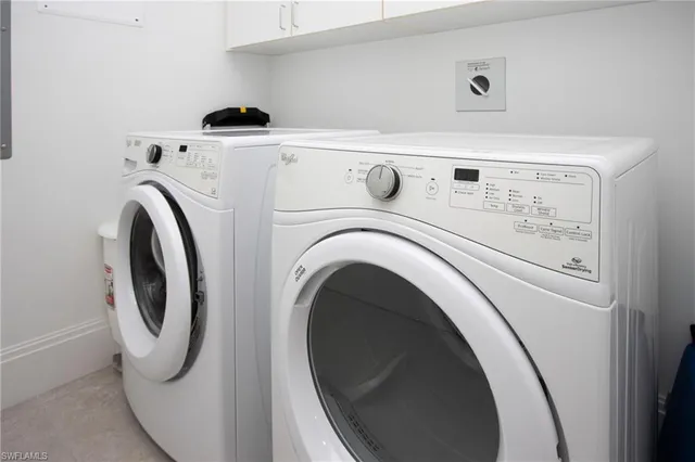 a view of a balcony with a table and chairs