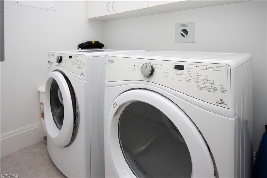 1035 3rd Avenue South, Unit 303 Naples, FL 34102 - Photo 17 of 26 a utility room with dryer and washer