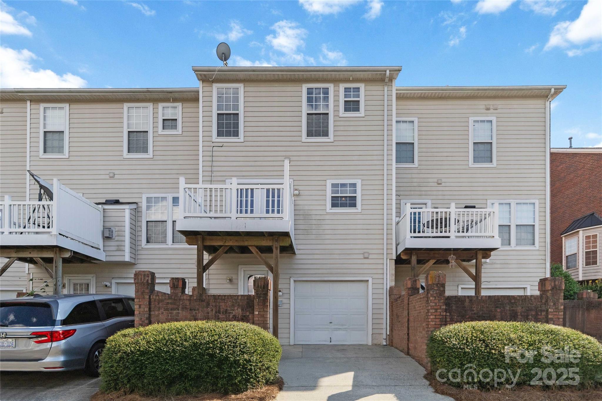 6825 Creft Circle, Unit 49 Indian Trail, NC 28079 - Photo 18 of 21 a front view of a house with garden