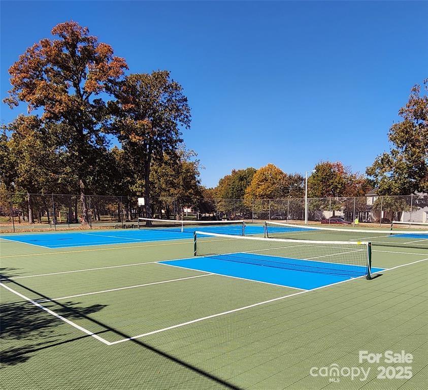 6825 Creft Circle, Unit 49 Indian Trail, NC 28079 - Photo 19 of 21 a view of an outdoor space and tennis court