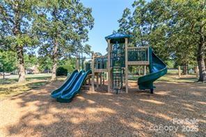 6825 Creft Circle, Unit 49 Indian Trail, NC 28079 - Photo 20 of 21 a view of a park with slide
