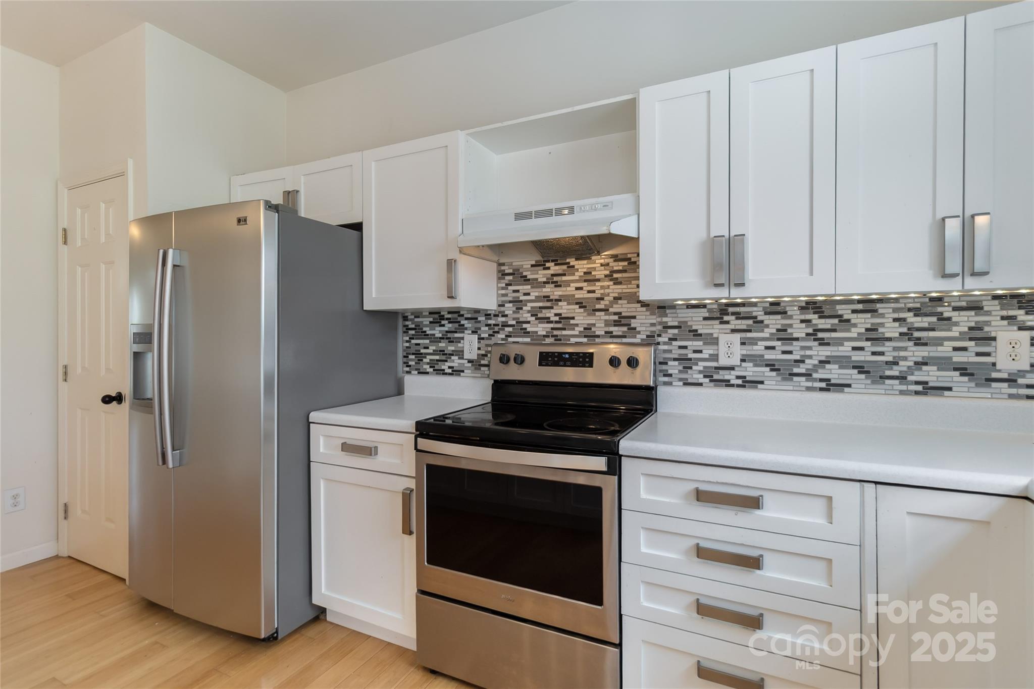6825 Creft Circle, Unit 49 Indian Trail, NC 28079 - Photo 4 of 21 a kitchen with appliances and cabinets