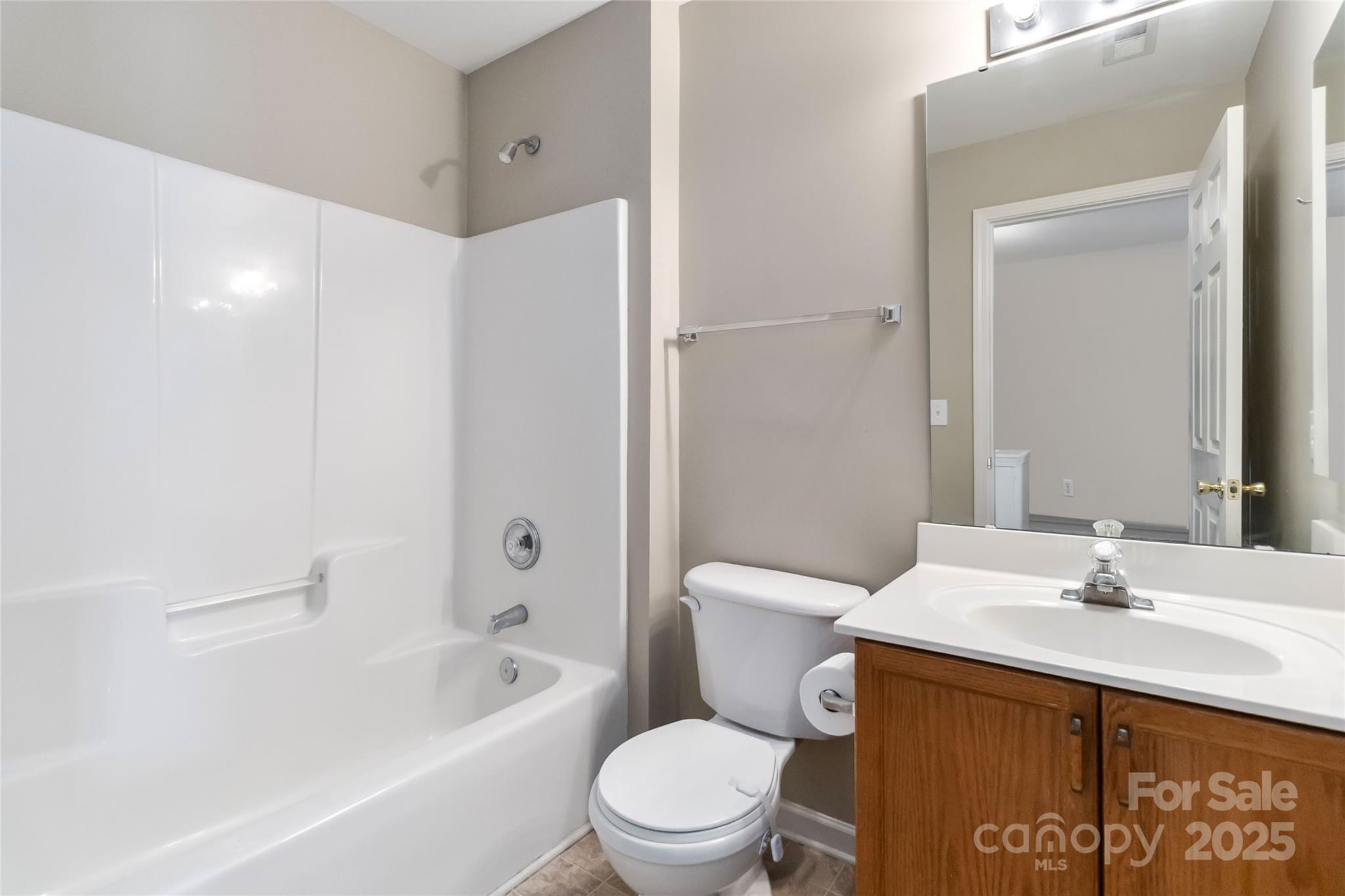 6825 Creft Circle, Unit 49 Indian Trail, NC 28079 - Photo 10 of 21 a bathroom with a sink a toilet and shower
