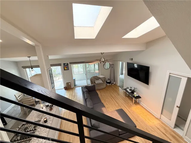 a view of a living room and a flat screen tv