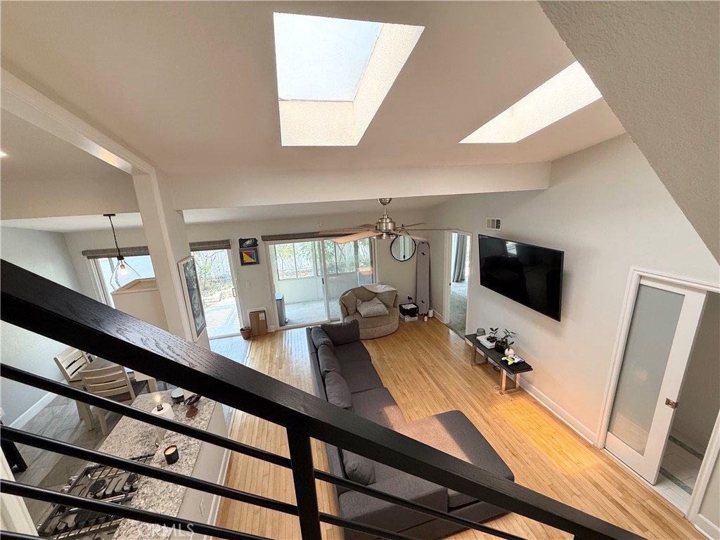a view of a living room and a flat screen tv