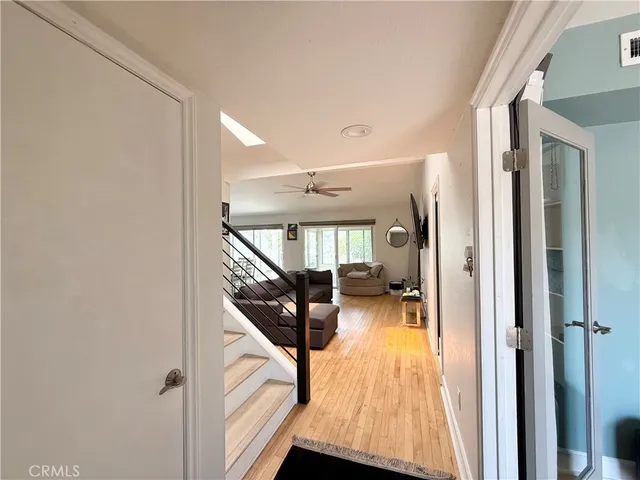 a view of a livingroom with furniture and hardwood floor