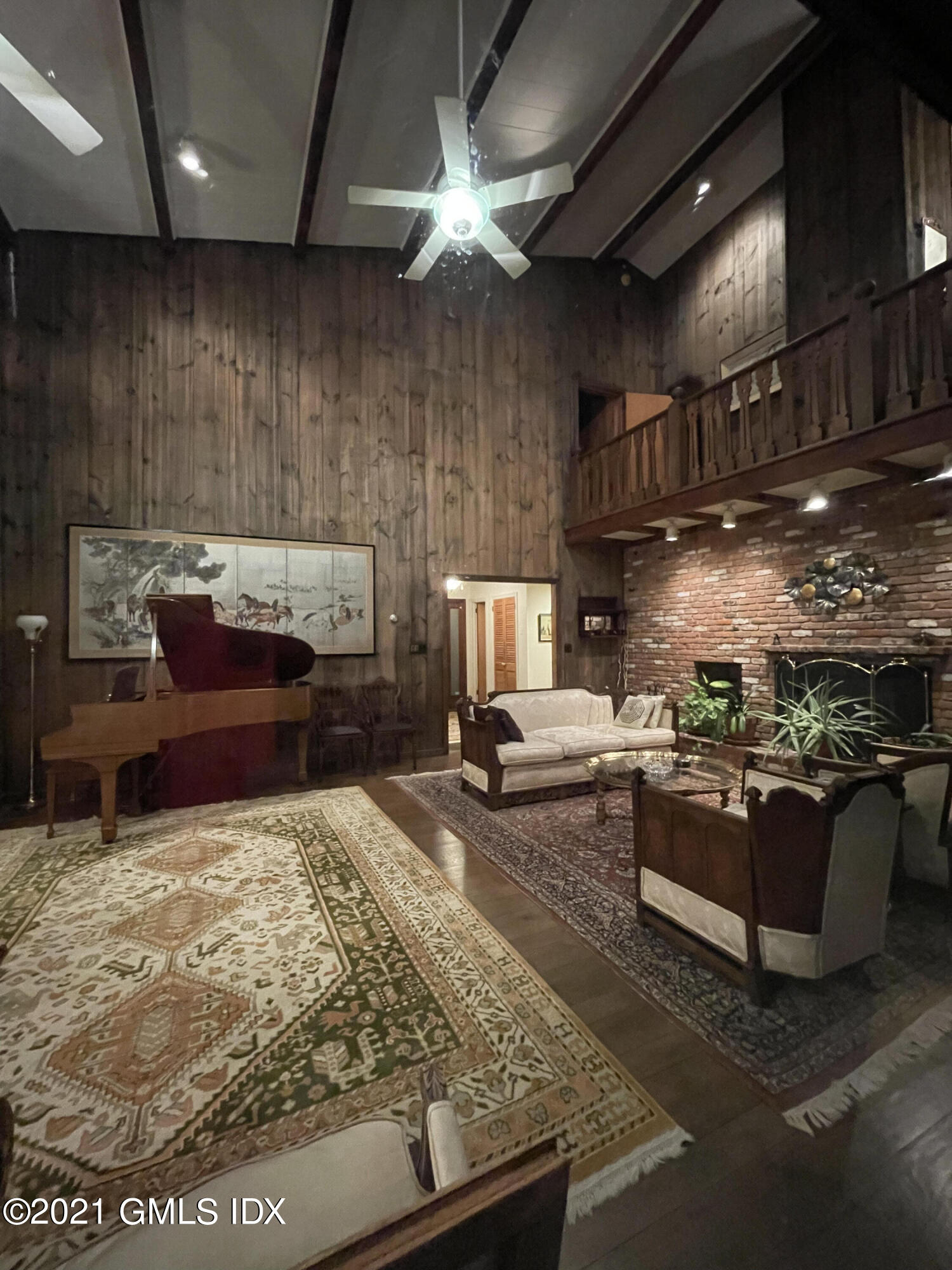 387 Stanwich Road Greenwich, CT 06830 - Photo 11 of 50 a living room with furniture and a fireplace