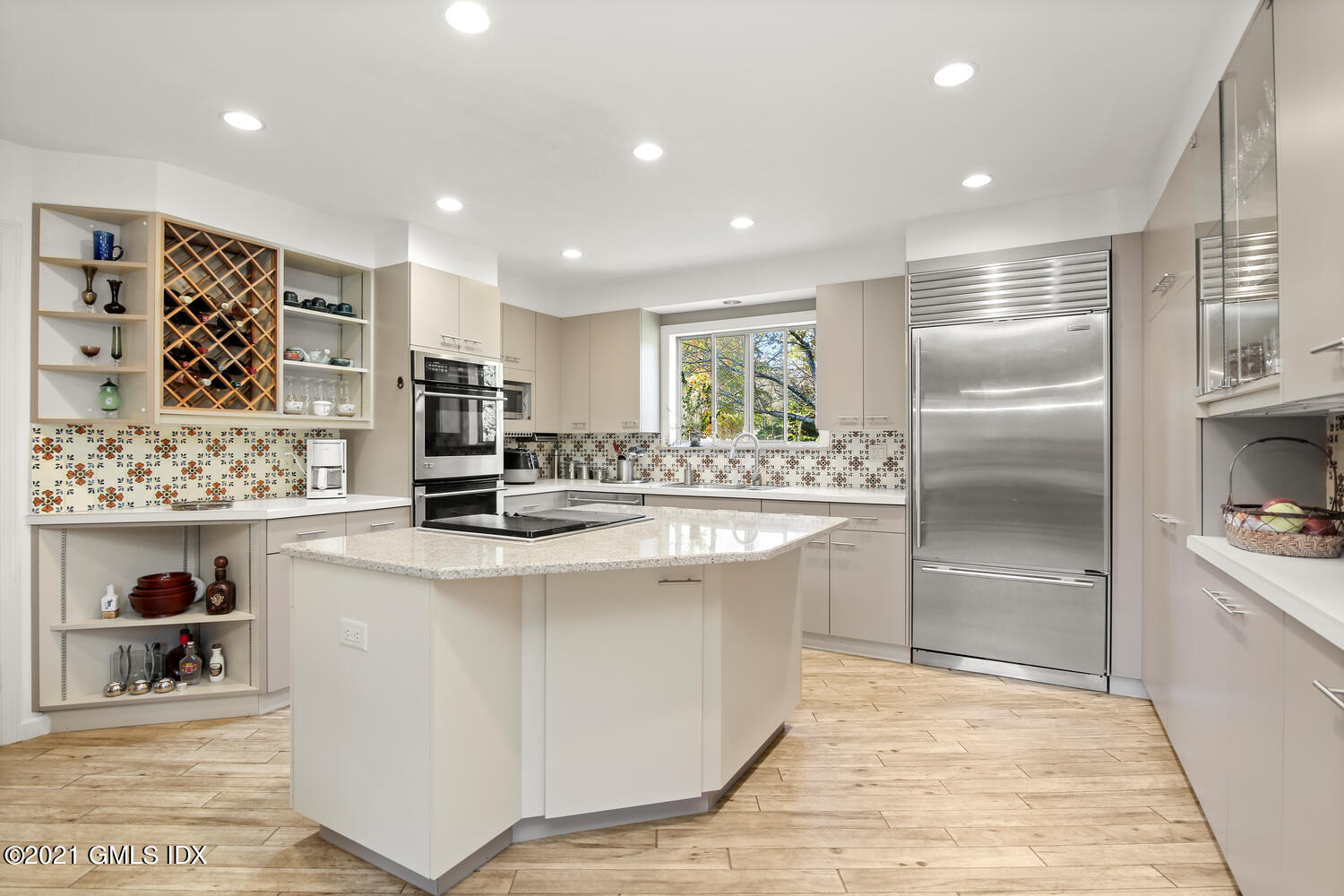 387 Stanwich Road Greenwich, CT 06830 - Photo 14 of 50 a kitchen with stainless steel appliances kitchen island granite countertop a refrigerator and a stove top oven