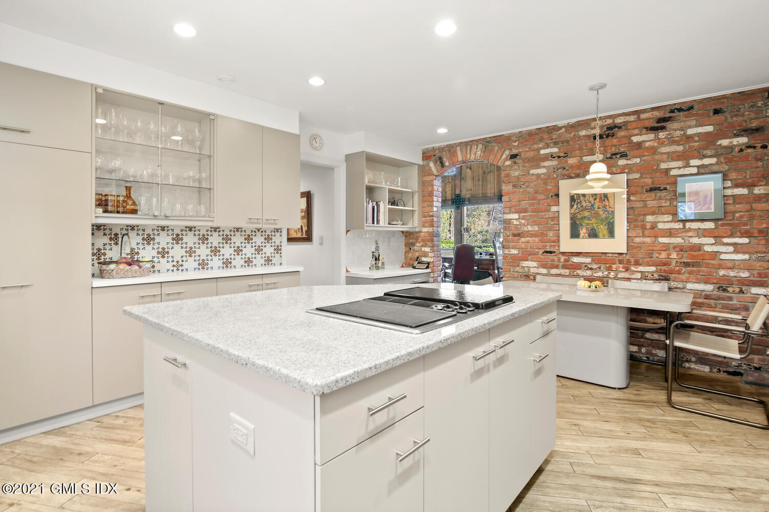 387 Stanwich Road Greenwich, CT 06830 - Photo 16 of 50 a kitchen with a sink and chairs