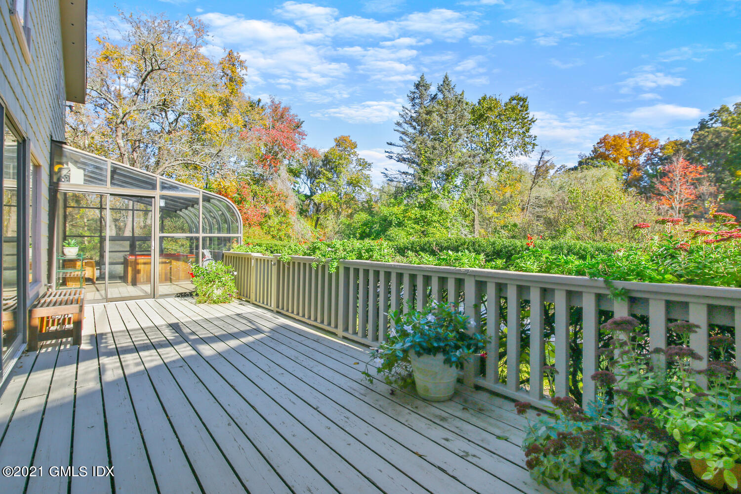 387 Stanwich Road Greenwich, CT 06830 - Photo 19 of 50 a balcony with wooden floor and outdoor space