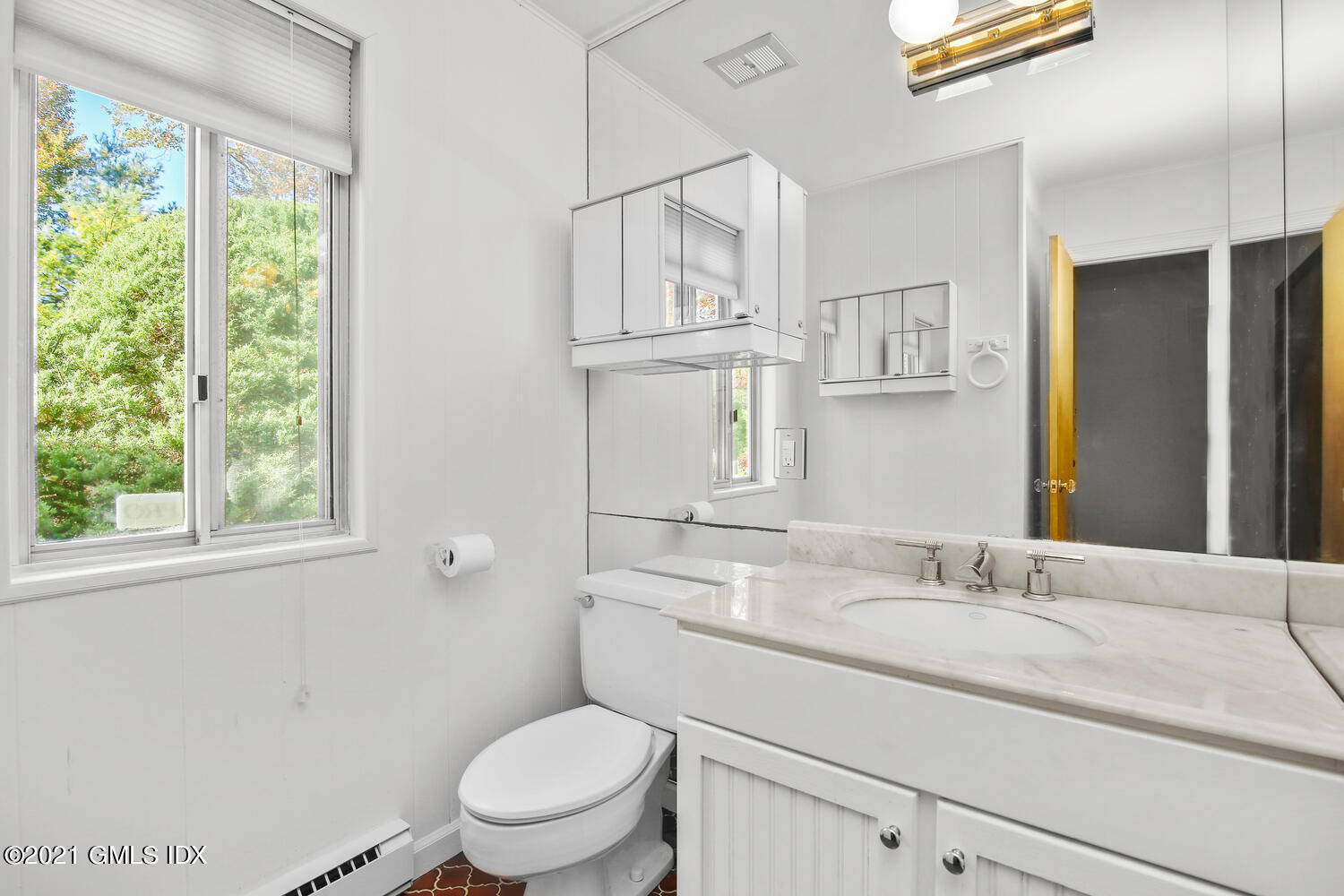 387 Stanwich Road Greenwich, CT 06830 - Photo 23 of 50 a bathroom with a granite countertop sink toilet and a mirror