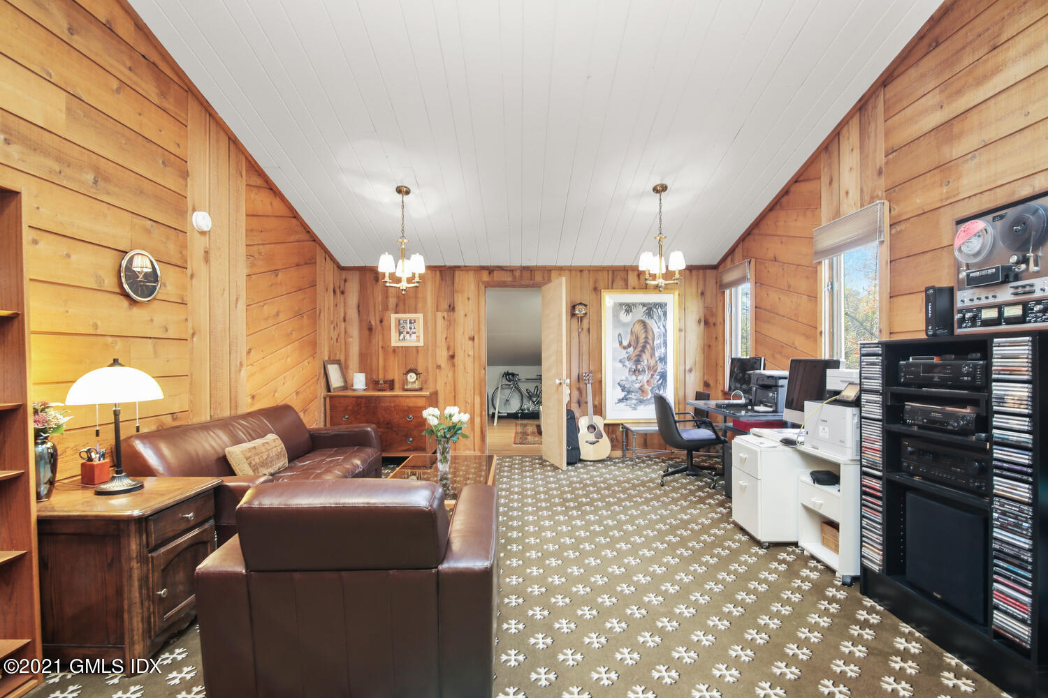 387 Stanwich Road Greenwich, CT 06830 - Photo 32 of 50 a living room with furniture a flat screen tv and large window