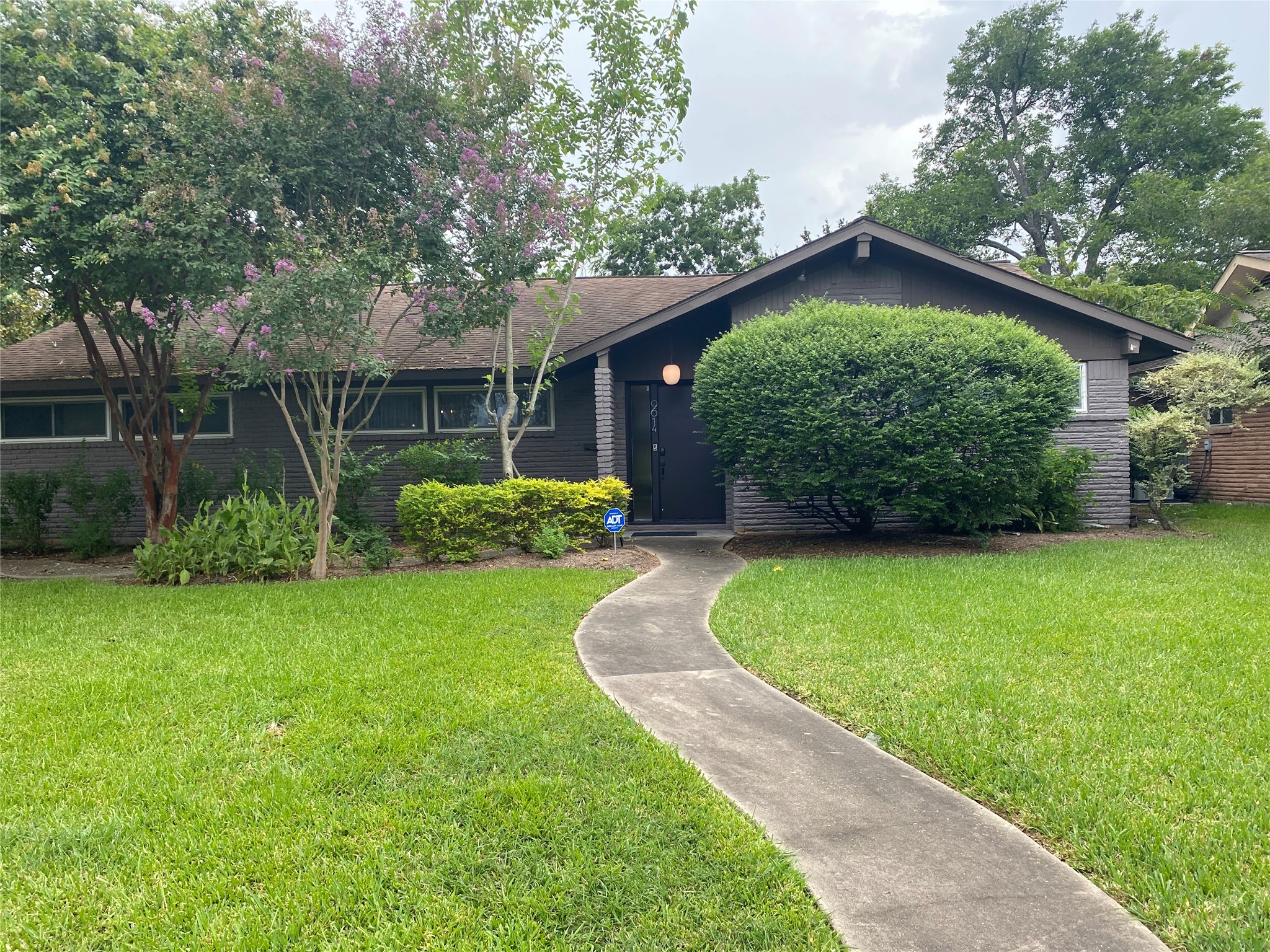 9614 Greenwillow Street Houston, TX 77096 - Photo 1 of 34 a backyard of a house with lots of green space