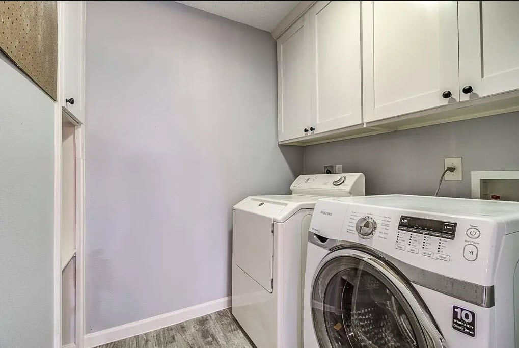 9614 Greenwillow Street Houston, TX 77096 - Photo 12 of 34 a utility room with dryer and washer