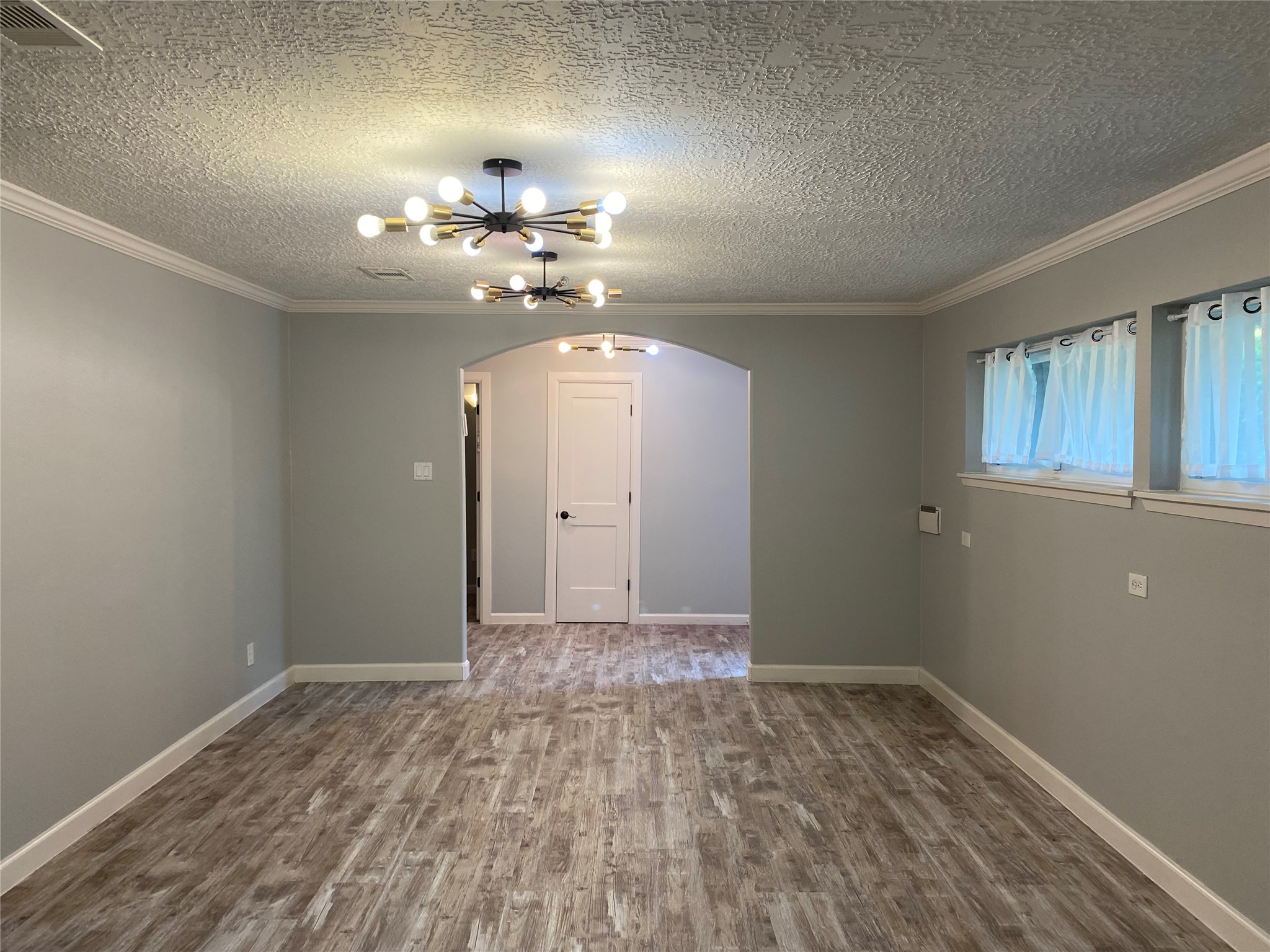 9614 Greenwillow Street Houston, TX 77096 - Photo 15 of 34 a view of an empty room with a chandelier fan