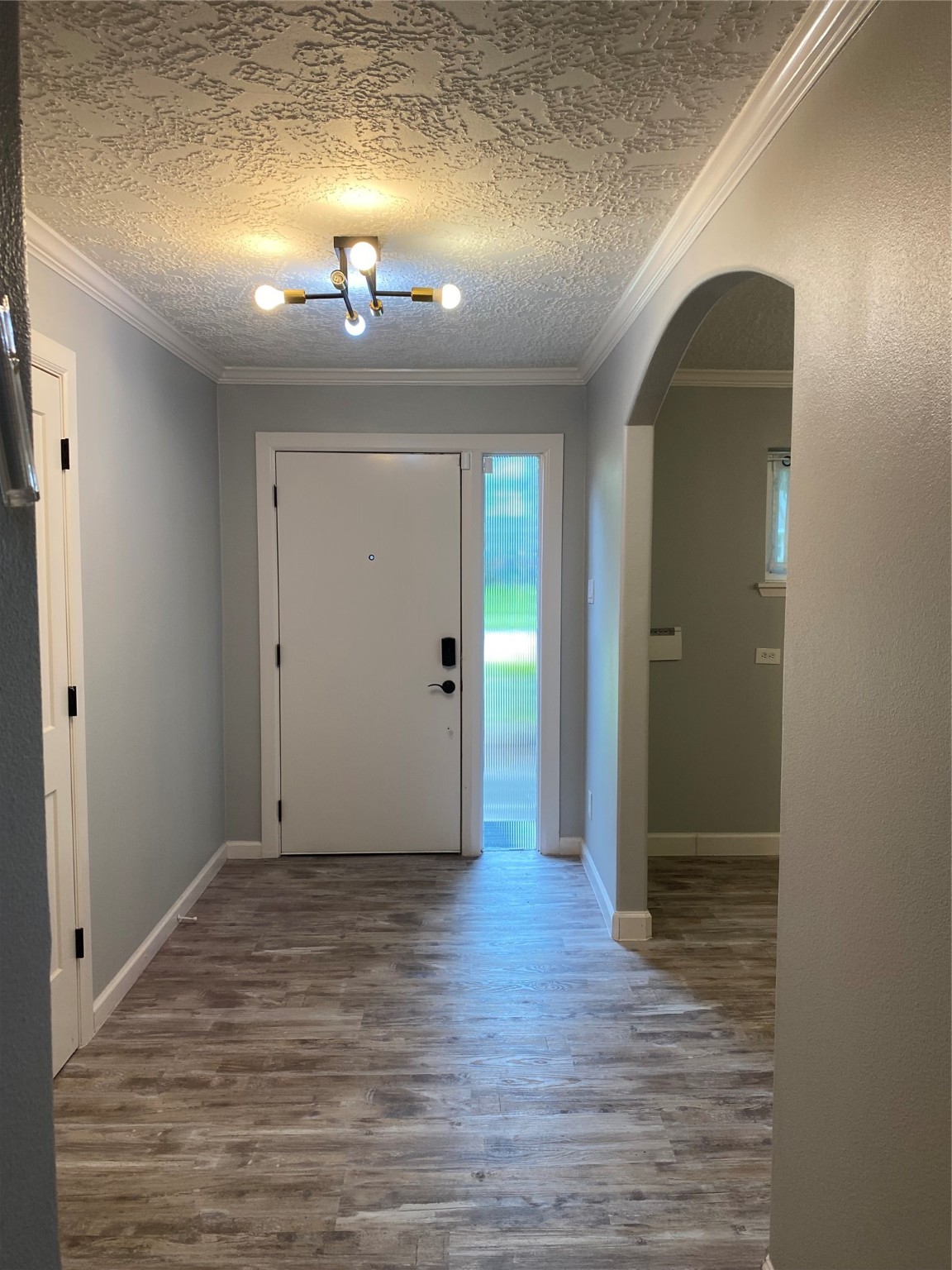 9614 Greenwillow Street Houston, TX 77096 - Photo 16 of 34 wooden floor in an empty room with a mirror