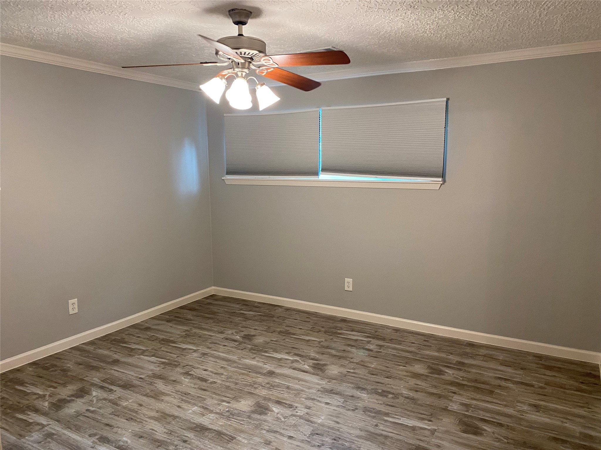 9614 Greenwillow Street Houston, TX 77096 - Photo 20 of 34 a view of a room with wooden floor and fan