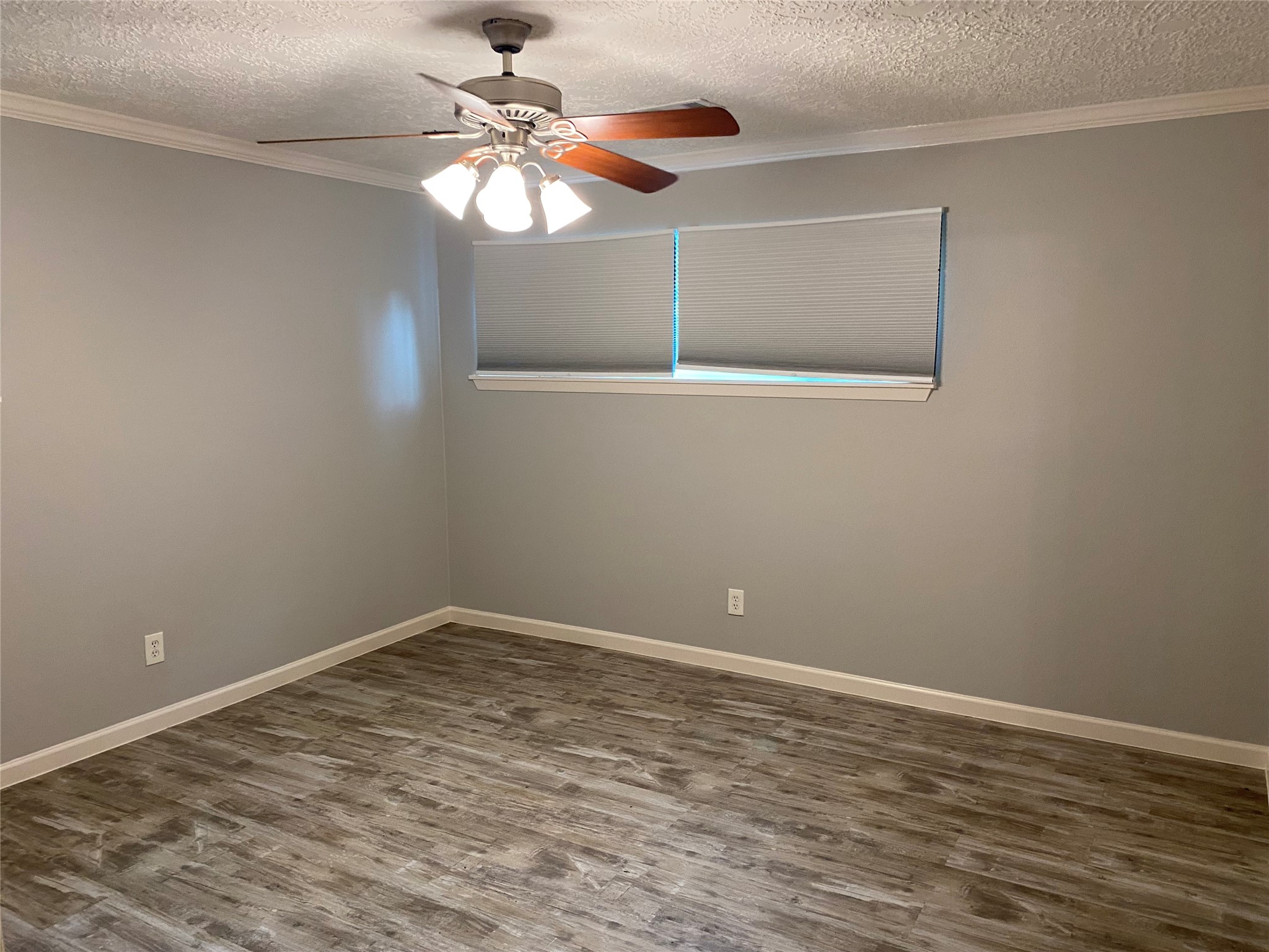 9614 Greenwillow Street Houston, TX 77096 - Photo 20 of 34 a view of a room with wooden floor and fan