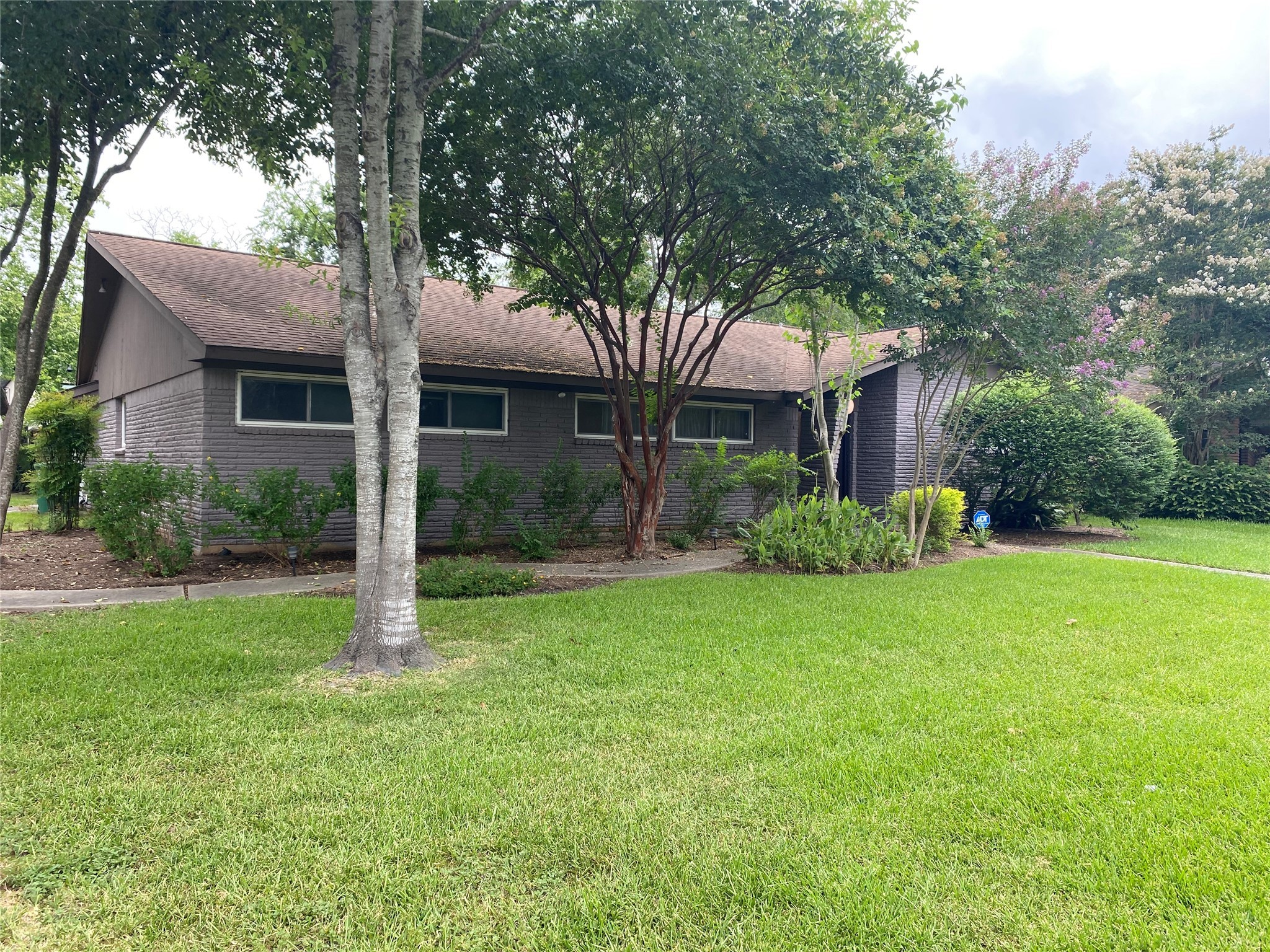 9614 Greenwillow Street Houston, TX 77096 - Photo 2 of 34 a front view of house with yard and green space