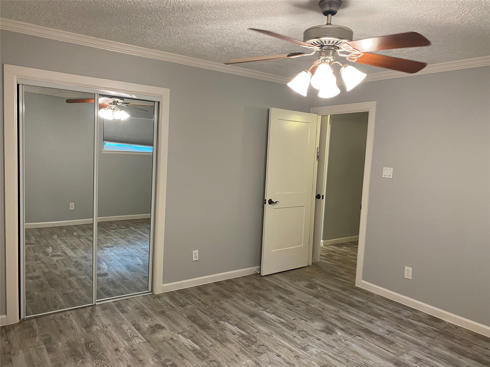 9614 Greenwillow Street Houston, TX 77096 - Photo 21 of 34 a view of an empty room with a chandelier fan