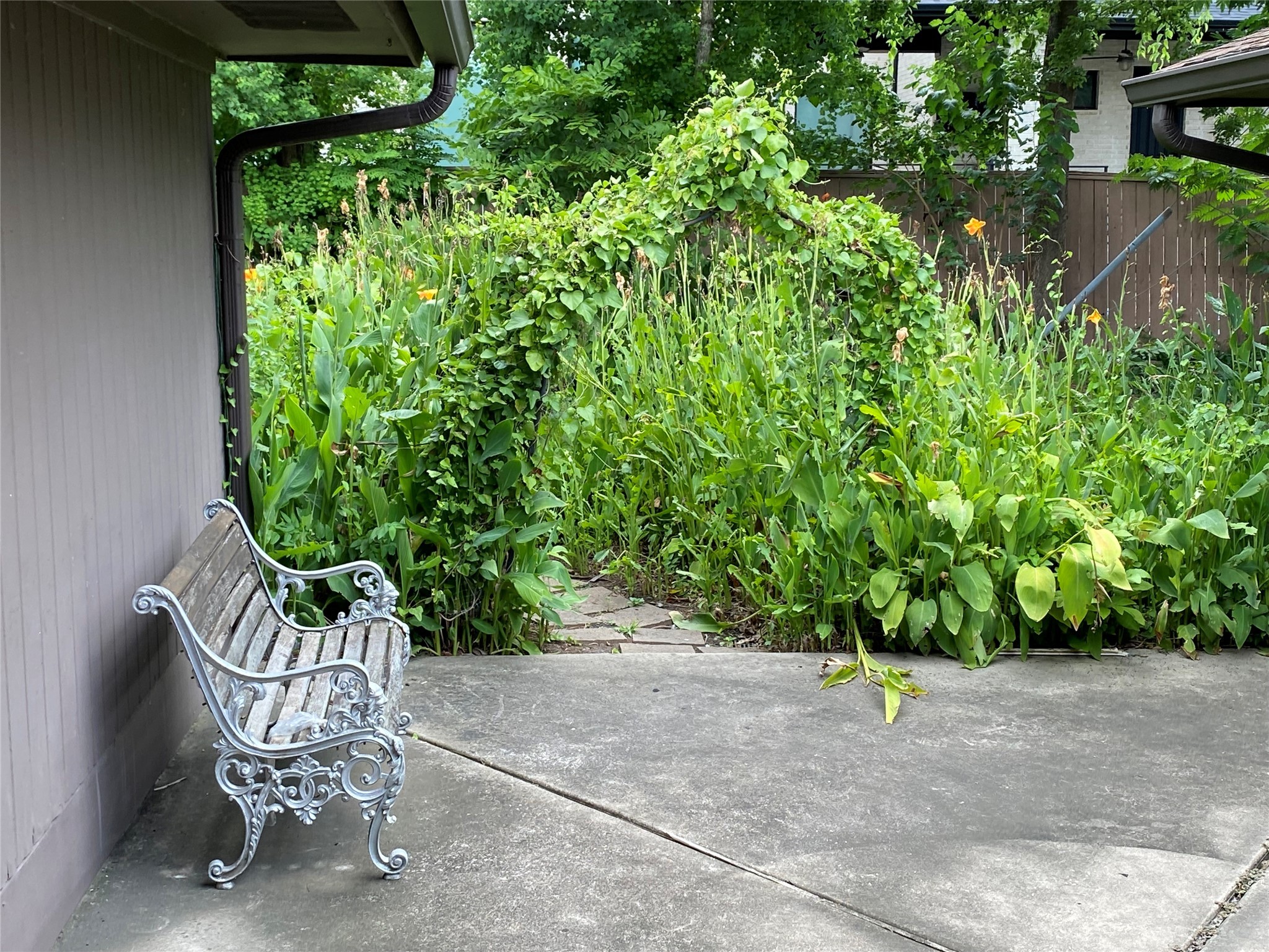 9614 Greenwillow Street Houston, TX 77096 - Photo 33 of 34 a view of a chairs and table in the backyard