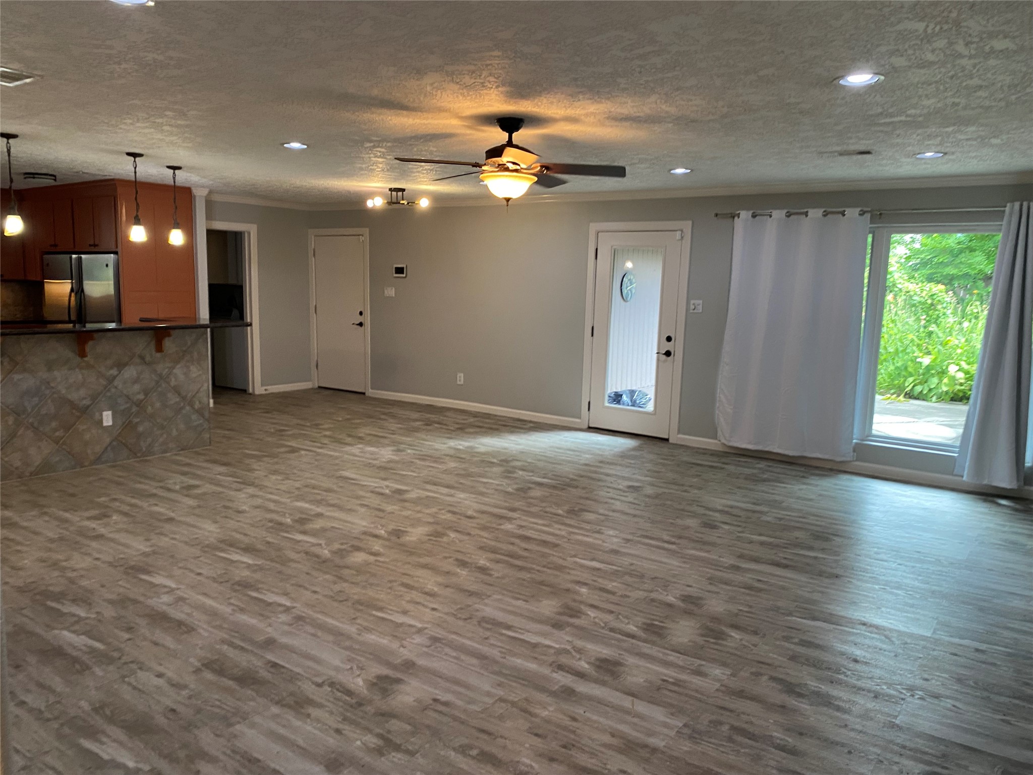 9614 Greenwillow Street Houston, TX 77096 - Photo 34 of 34 a view of a livingroom with a ceiling fan and window