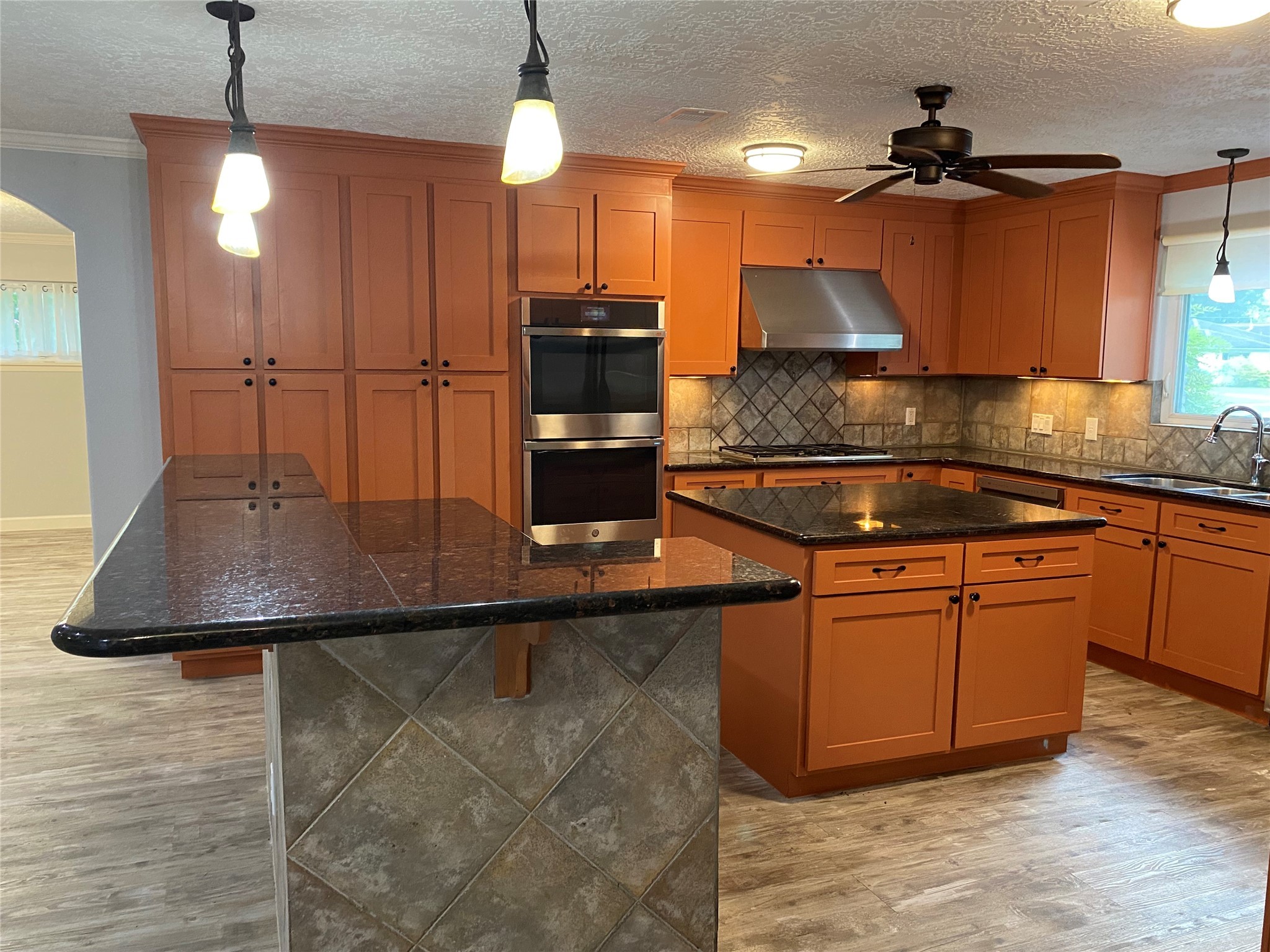 9614 Greenwillow Street Houston, TX 77096 - Photo 5 of 34 a kitchen with stainless steel appliances granite countertop a sink and a microwave
