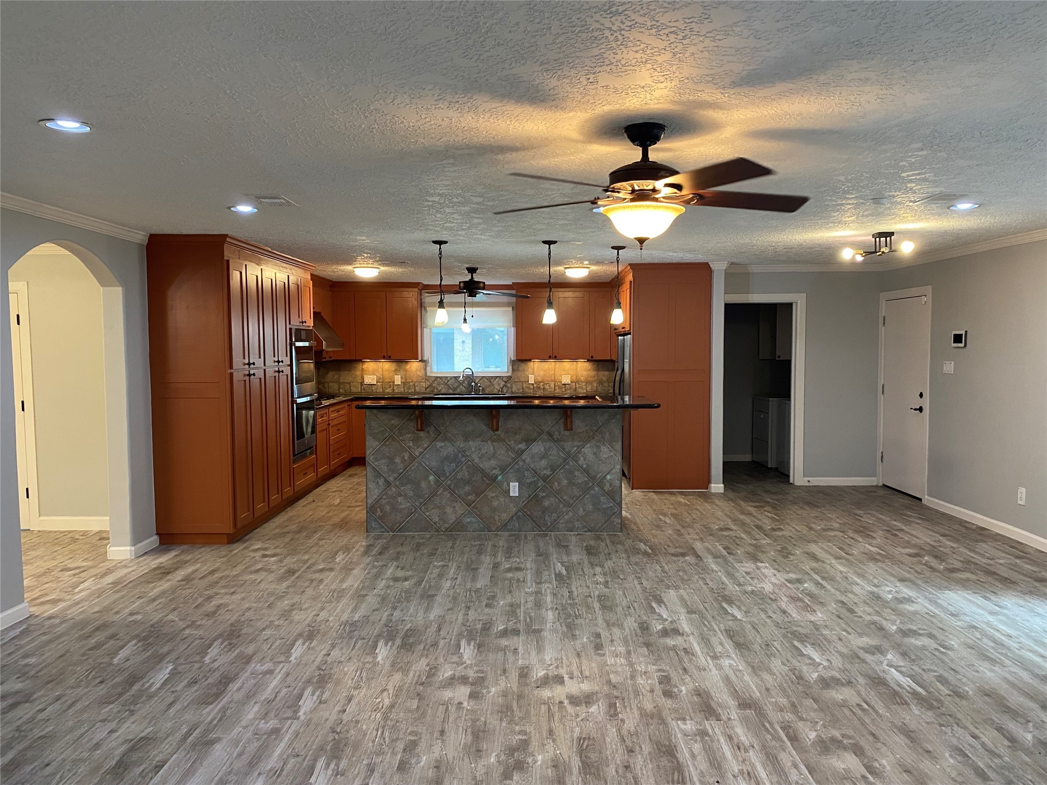 9614 Greenwillow Street Houston, TX 77096 - Photo 10 of 34 a view of a kitchen with a refrigerator and a chandelier