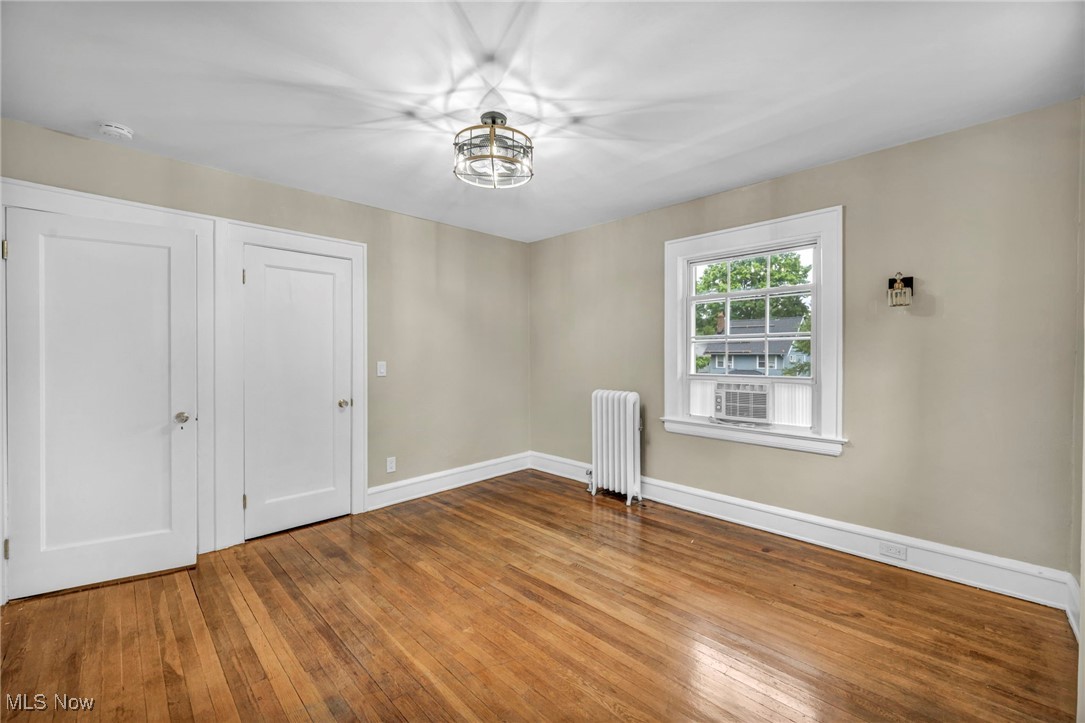 2980 East Overlook Road Cleveland, OH 44118 - Photo 30 of 49 Unfurnished bedroom with hardwood / wood-style flooring and radiator heating unit