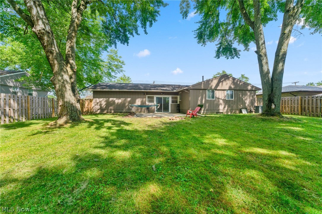 2494 North Road Southeast Warren, OH 44484 - Photo 3 of 21 Rear view of property with a patio and a lawn