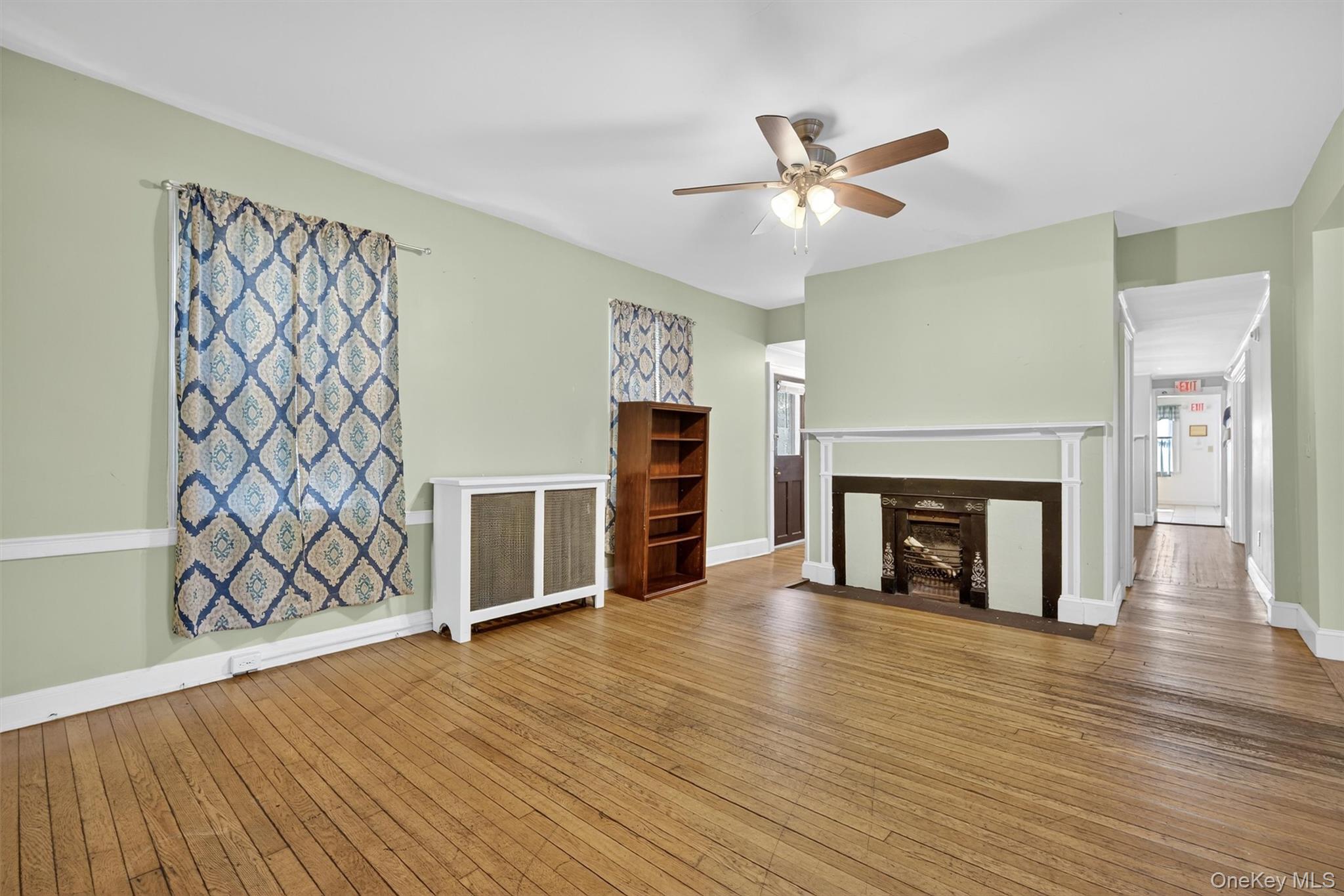 1 Angola Road Cornwall, NY 12518 - Photo 15 of 31 an empty room with wooden floor fireplace and windows