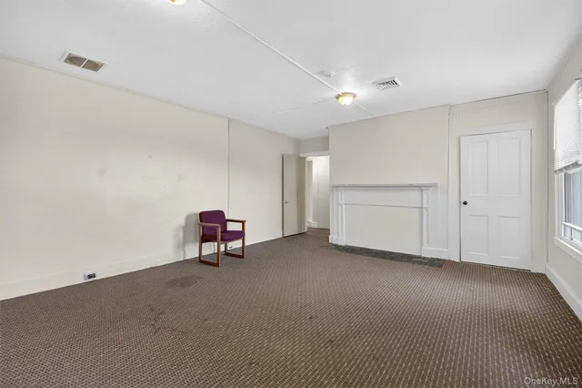 a living room with a couch and a table in it