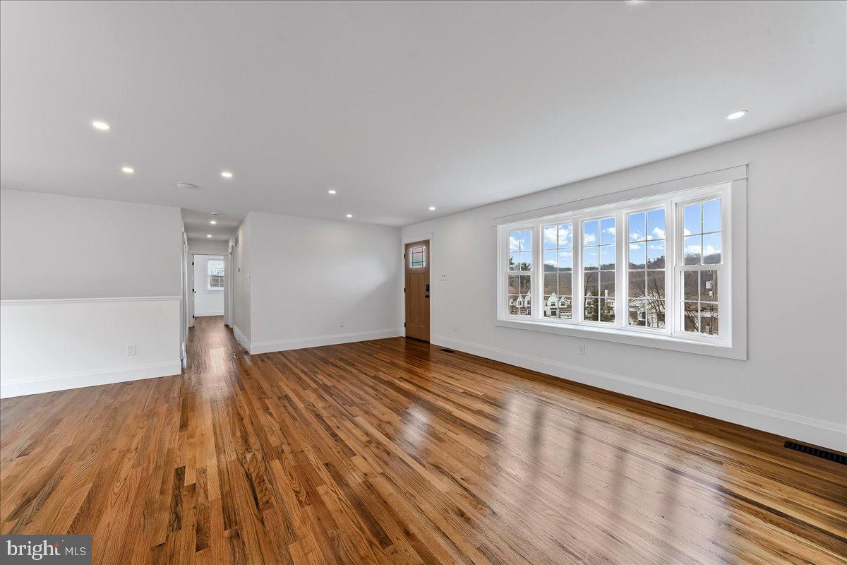919 South Concord Road West Chester, PA 19382 - Photo 11 of 31 a view of an empty room with wooden floor and a window