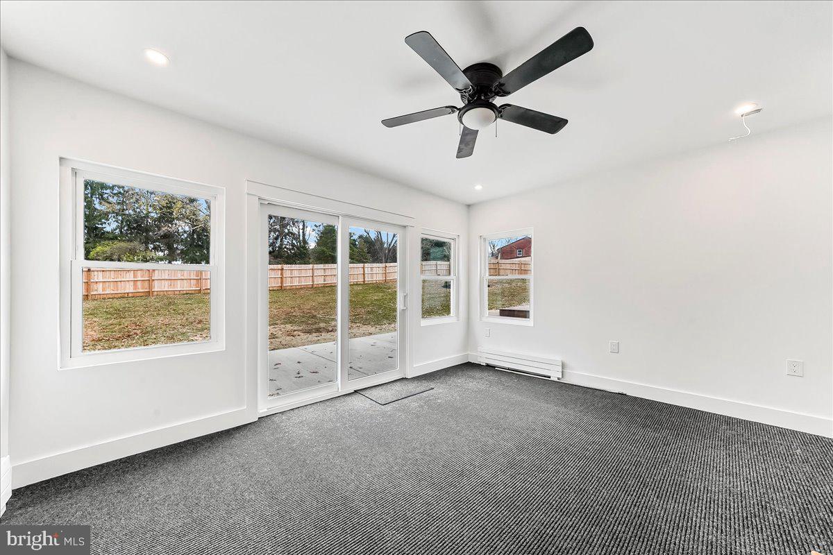 919 South Concord Road West Chester, PA 19382 - Photo 14 of 31 an empty room with windows and ceiling fan