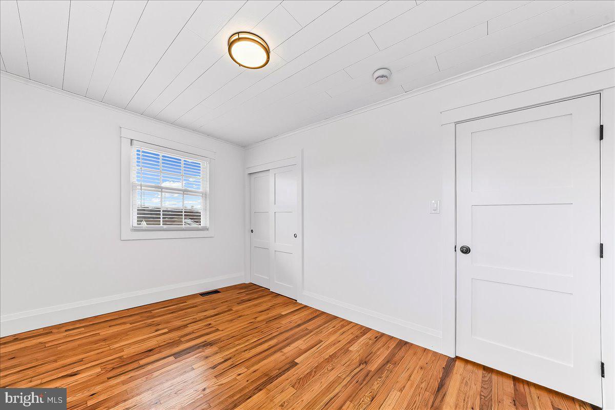 919 South Concord Road West Chester, PA 19382 - Photo 17 of 31 a view of empty room with wooden floor