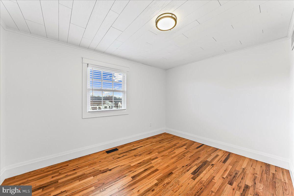 919 South Concord Road West Chester, PA 19382 - Photo 20 of 31 a view of a room with wooden floor and white walls