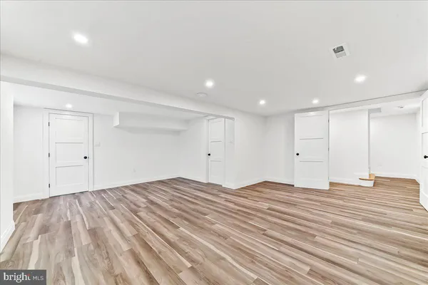 a living room with furniture a rug and a table