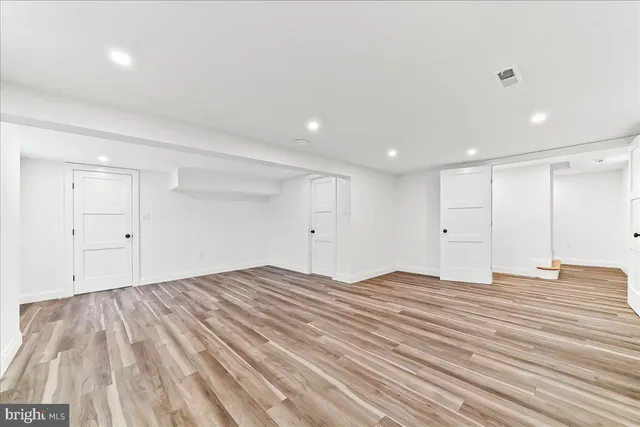 a living room with furniture a rug and a table