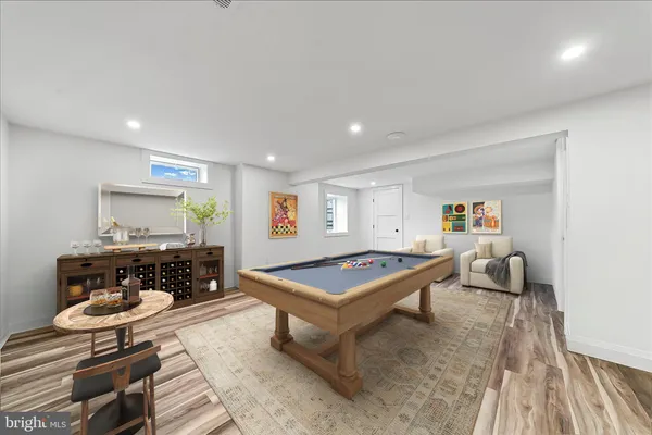 a utility room with cabinets washer and dryer