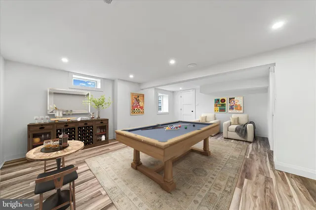 a utility room with cabinets washer and dryer