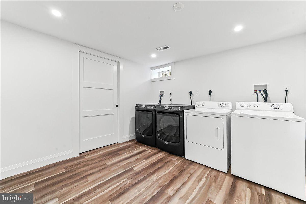 919 South Concord Road West Chester, PA 19382 - Photo 28 of 31 a utility room with cabinets washer and dryer