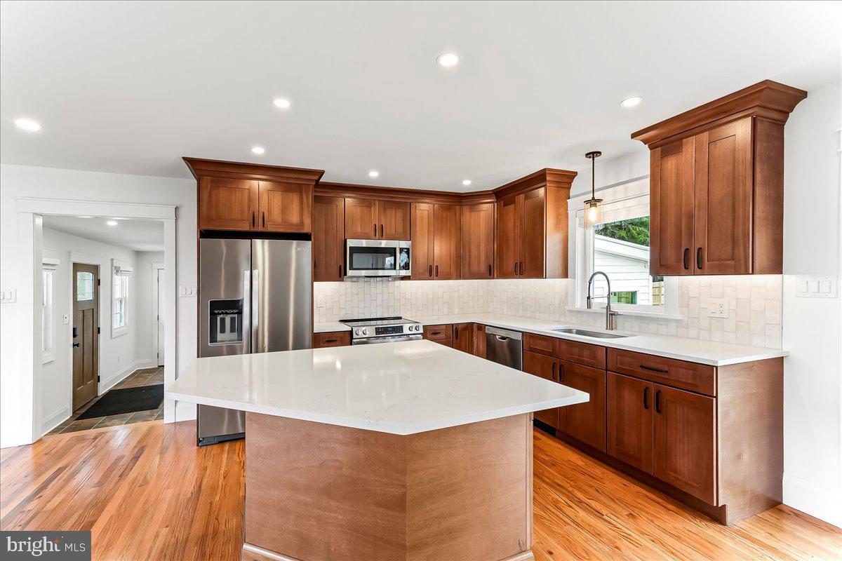 919 South Concord Road West Chester, PA 19382 - Photo 6 of 31 a kitchen with stainless steel appliances a sink and a refrigerator
