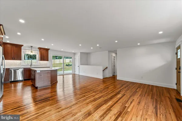 a view of kitchen with cabinets and wooden floor