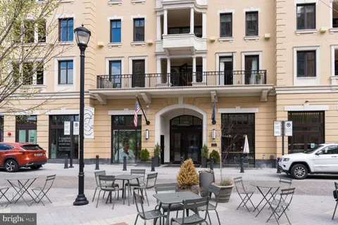 a view of a brick building with many windows