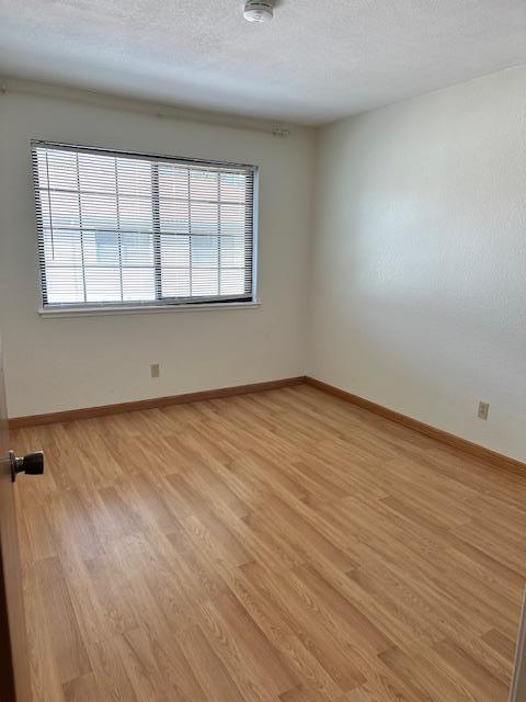 362 Kenbrook Circle San Jose, CA 95111 - Photo 14 of 19 wooden floor in an empty room with a window
