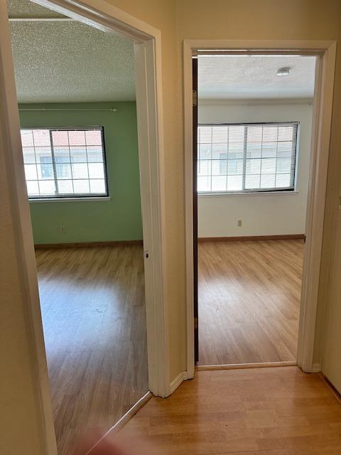 362 Kenbrook Circle San Jose, CA 95111 - Photo 10 of 19 an empty room with wooden floor cabinet and windows