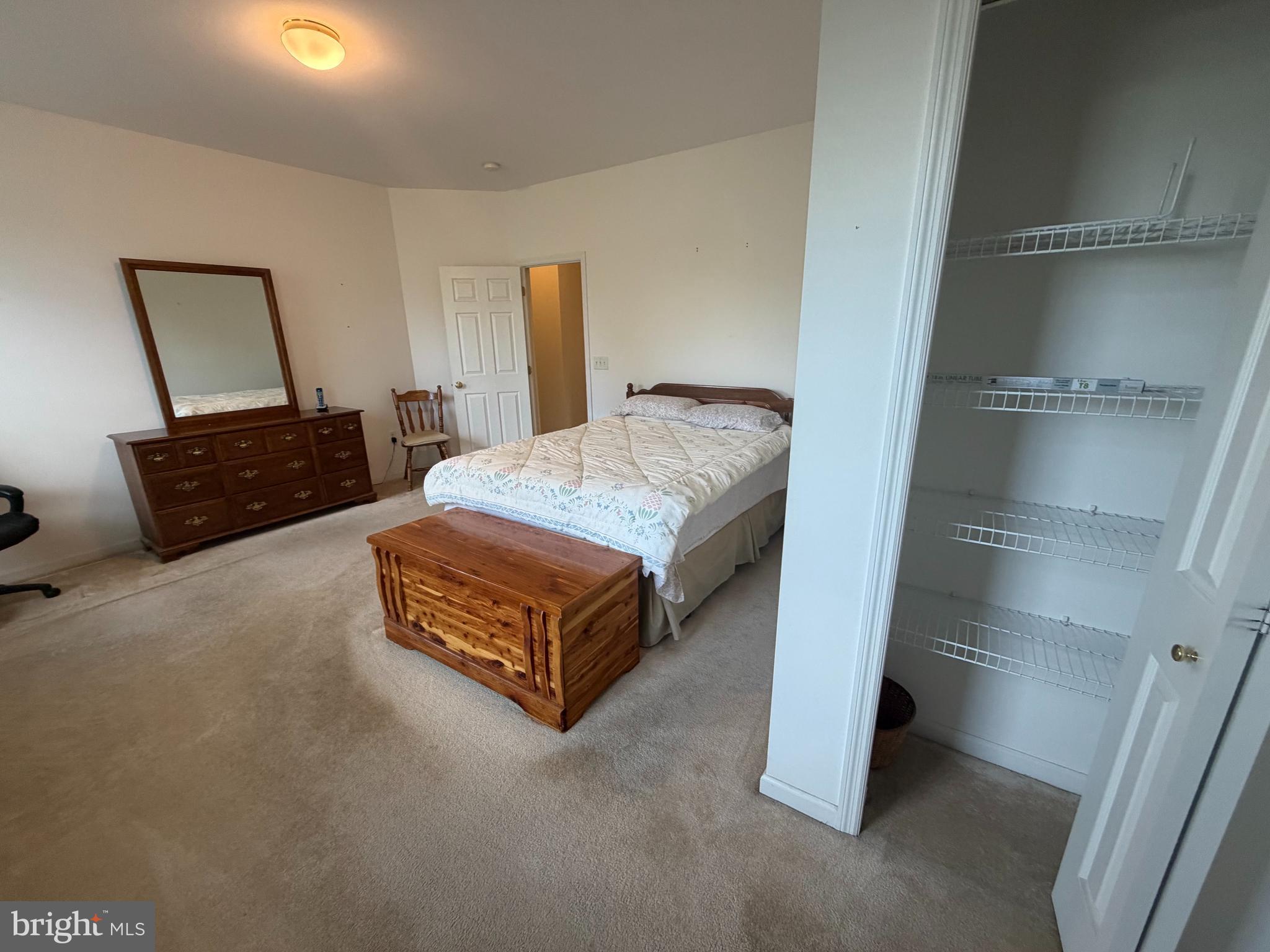 428 Haymarket Lane Lititz, PA 17543 - Photo 19 of 31 a spacious bedroom with a bed and a couch