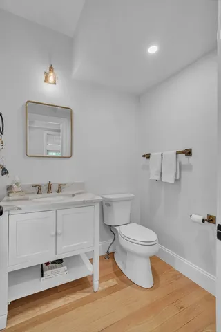 a spacious bedroom with a large bed and a window