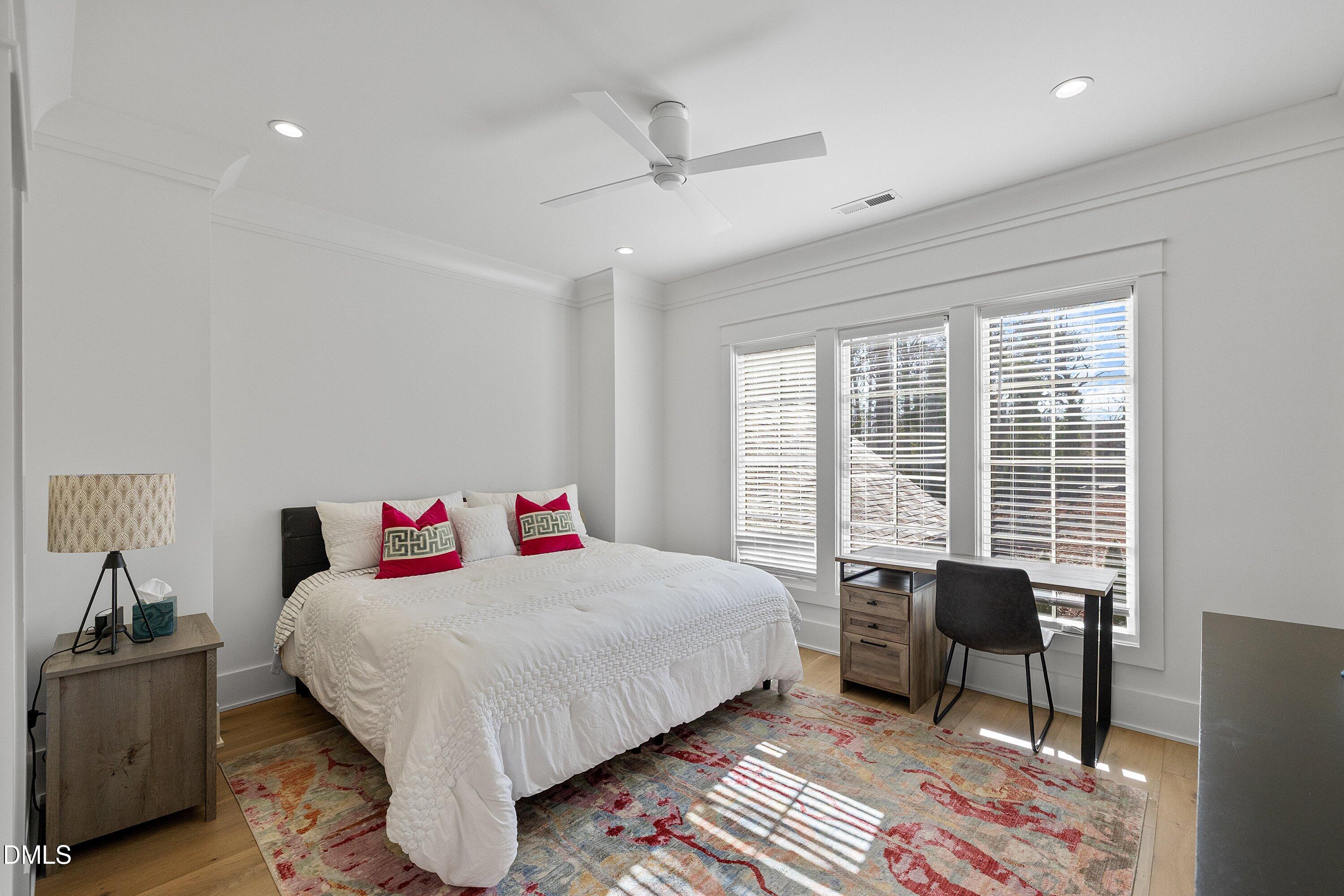 906 Brooks Avenue Raleigh, NC 27607 - Photo 43 of 64 a bedroom with a bed and a table