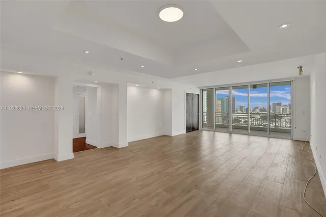 a kitchen with kitchen island a sink stainless steel appliances and cabinets